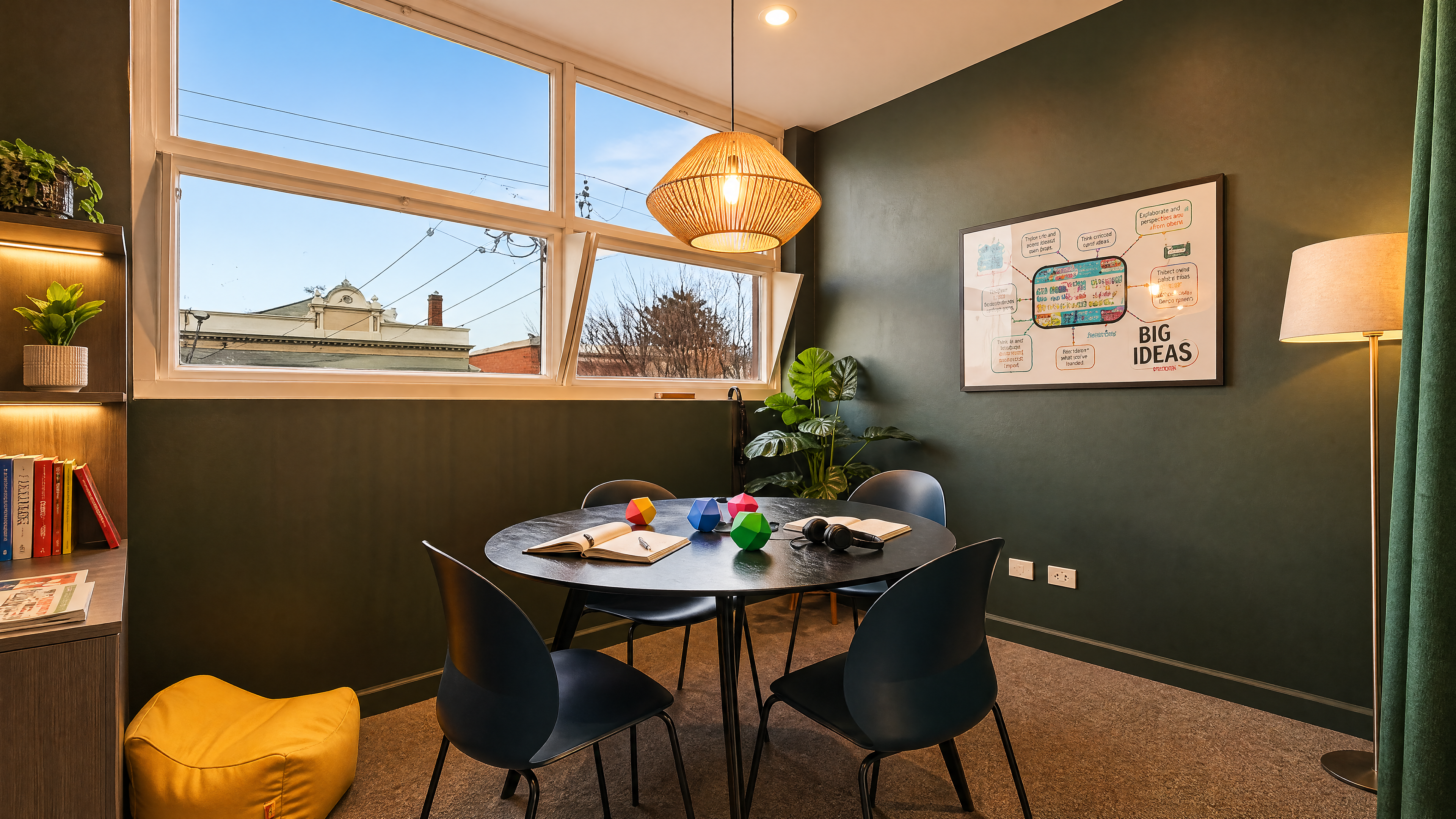 Smaller meeting room — deep green walls, single pendant.